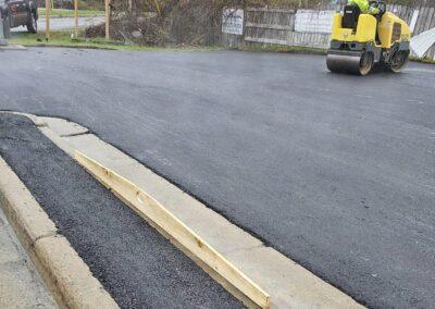 worker rolling the road
